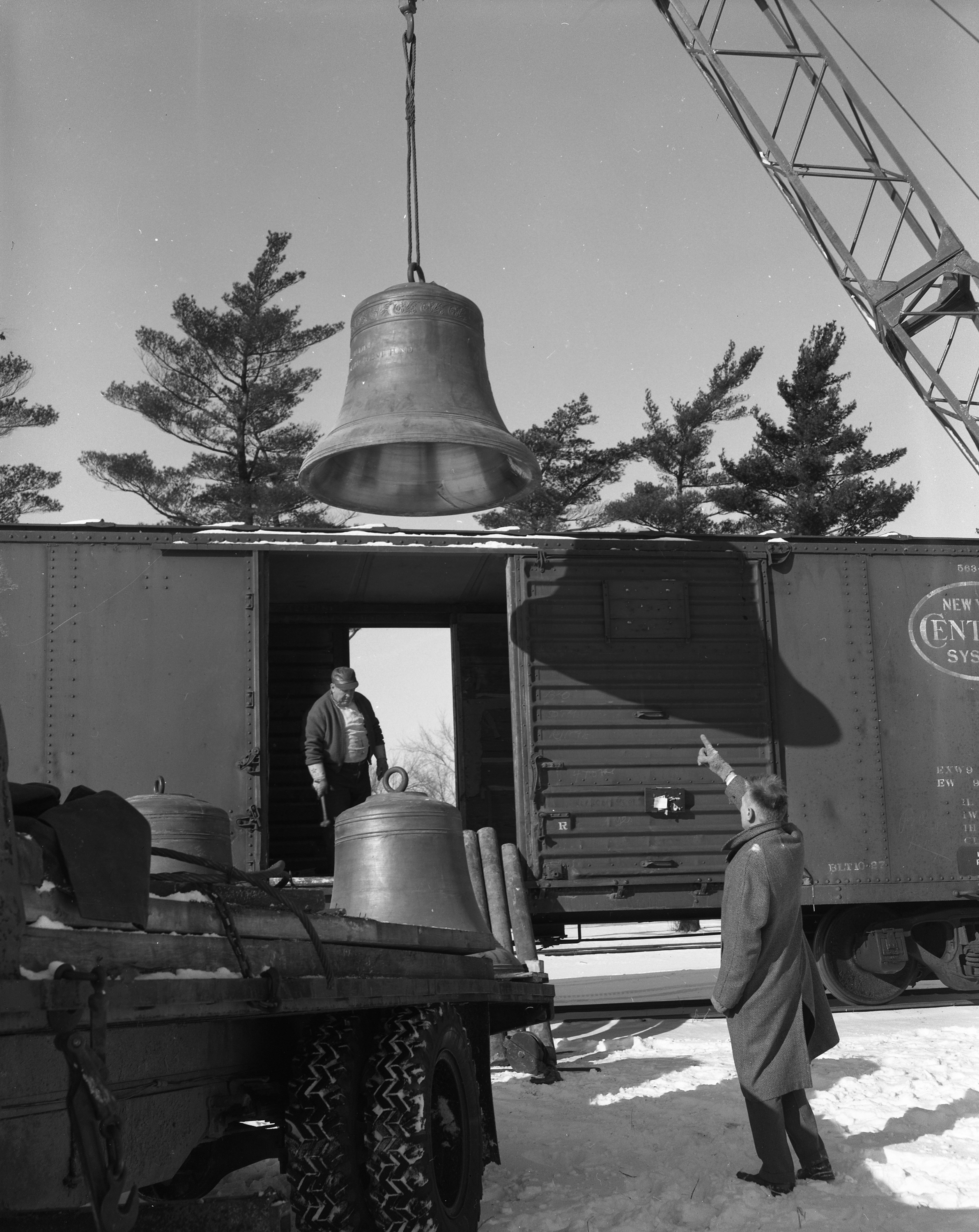 Bell being hoisted out of a train; January 6, 1959