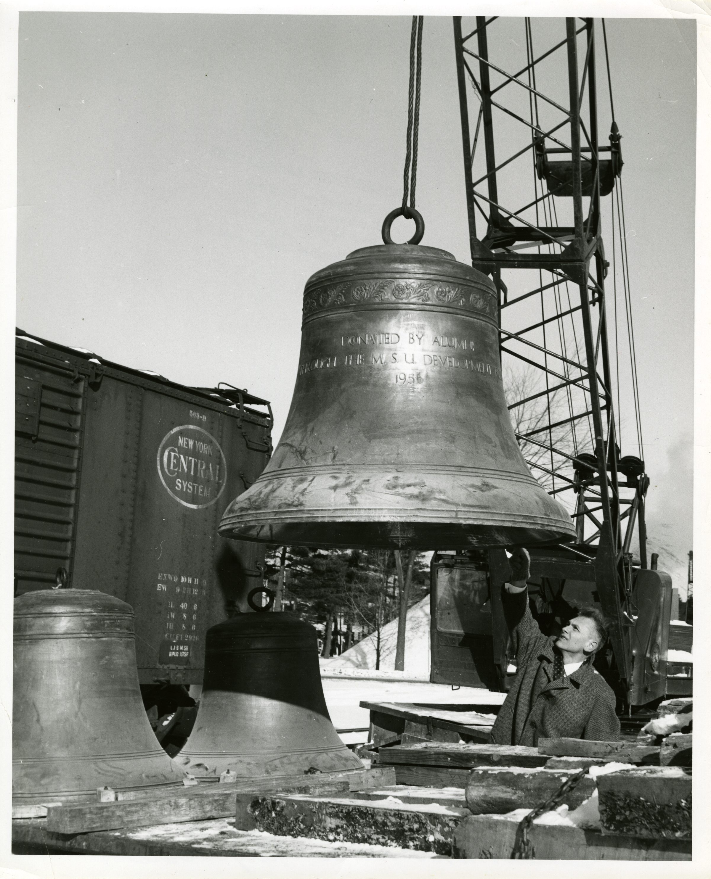 Wendell Wescott inspecting a Beaumont Tower bell, January 6, 1959