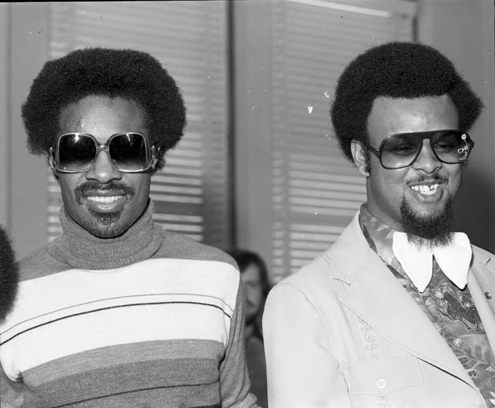 Stevie Wonder and Another Person