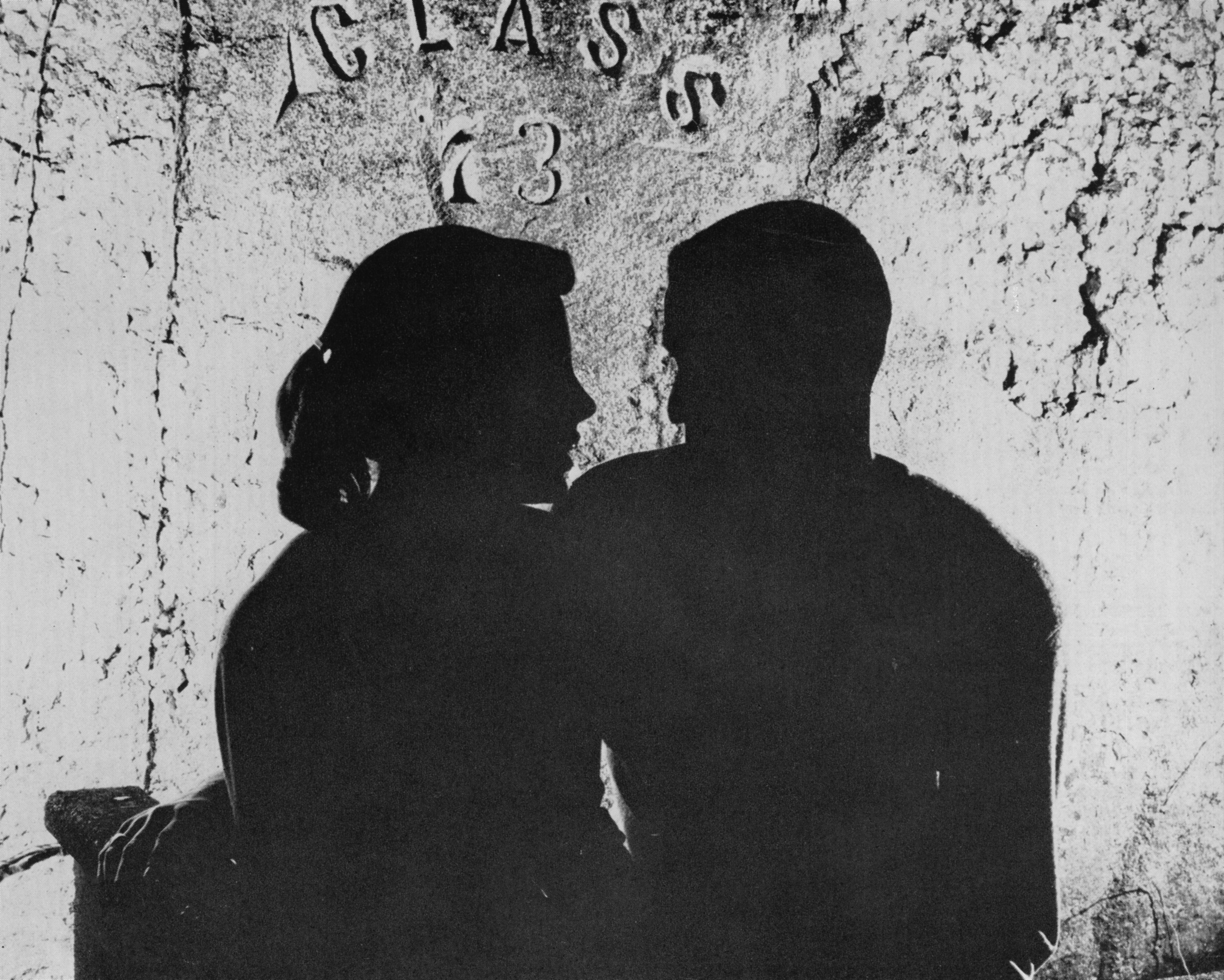 Silhouette of couple in front of the Rock, ca. 1955