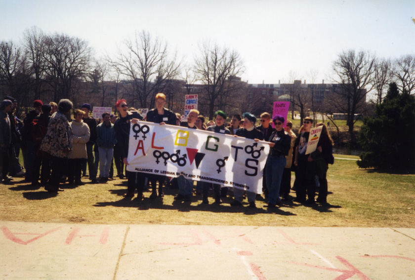 Students hold a ALBGTS banner during a Pride Week event, circa 1995