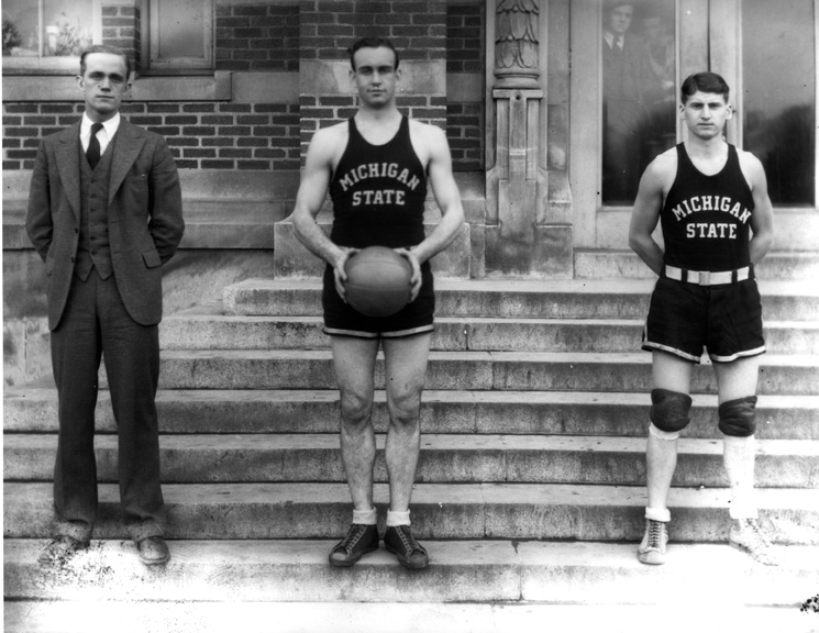 Two basketball players and a coach, 1930