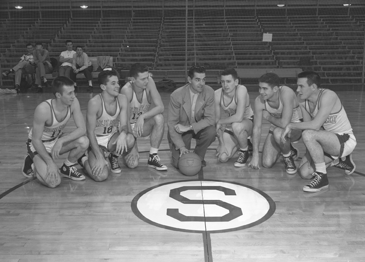 Varsity Basketball Team Kneeling on the Gym Floor, Circa 1951