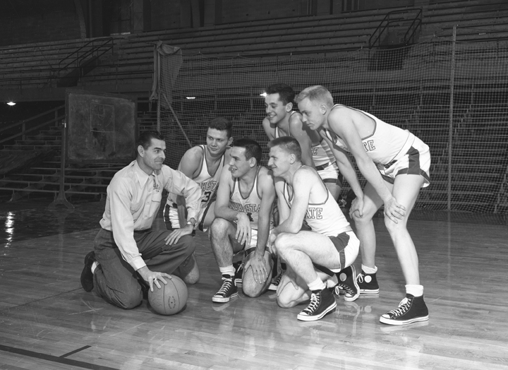Varsity Basketball Team Kneeling with Coach, circa 1951