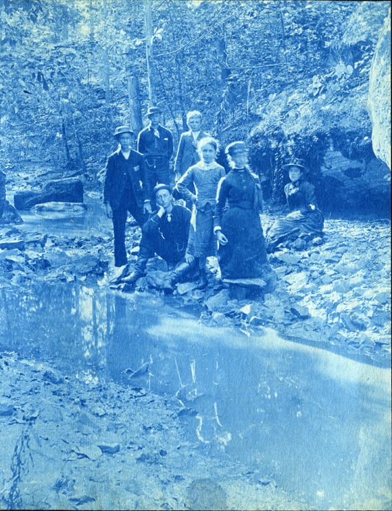 15. Men and women next to a river or creek, circa 1888.