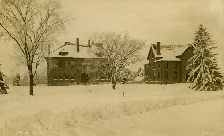 Two campus buildings during the winter, postmarked 1912