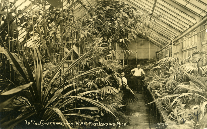 Two people inside the Greenhouse