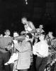 A group carry basketball player Johnny Green on their shoulders, 1957
