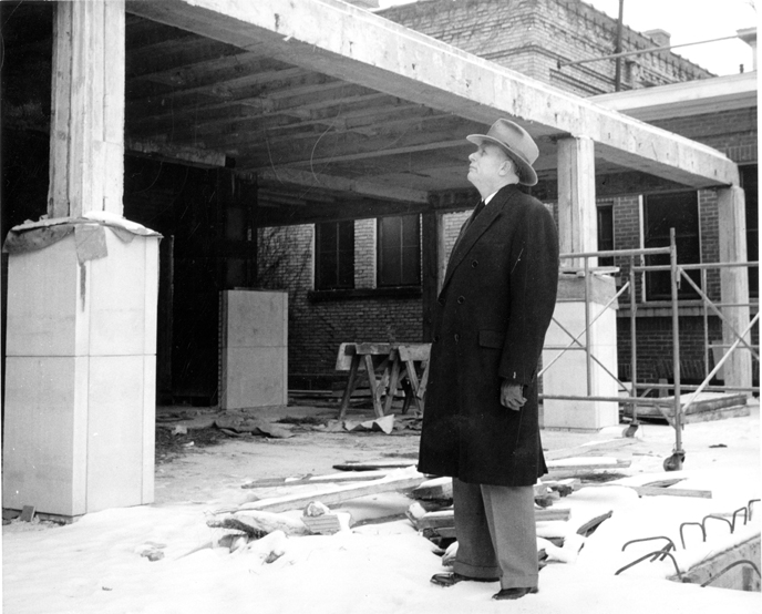 President Hannah surveys construction of the Library, 1955