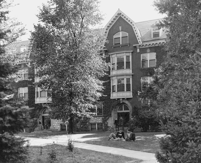 Students on the lawn outside of Wells Hall