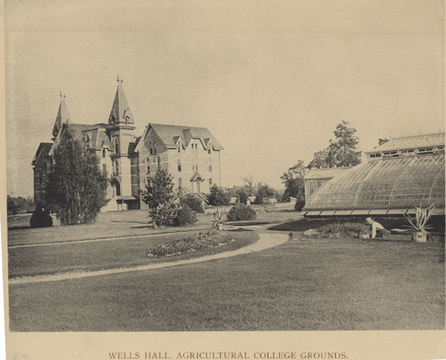 Wells Hall (old) and a greenhouse