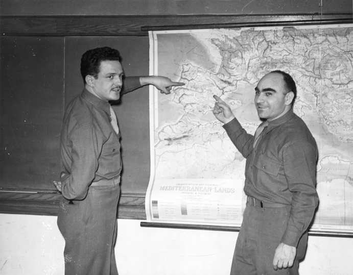 Two men with a European map, date unknown