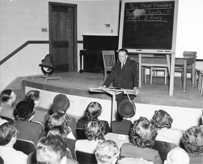 John Hannah addresses new staff members, 1949