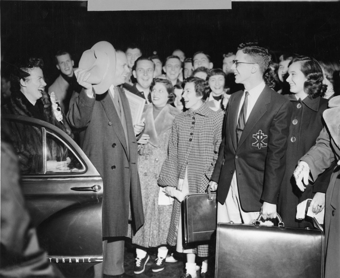 Hannah greets a crowd of students, 1953