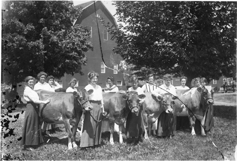 Female students with cows, 1916