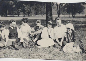 Students lounge in the grass, date unknown