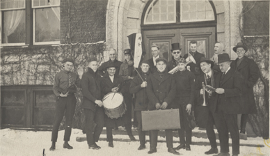 Students form a band in front of Wells Hall, ca. 1918 