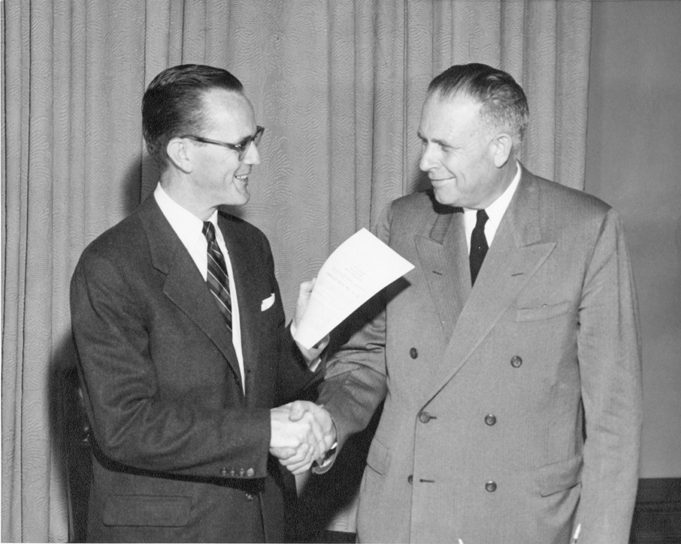 John Hannah at a MSU bill signing, 1955