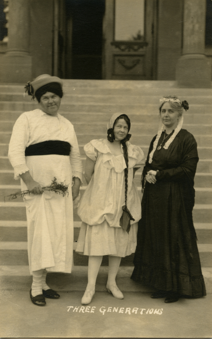 Three people standing together, undated