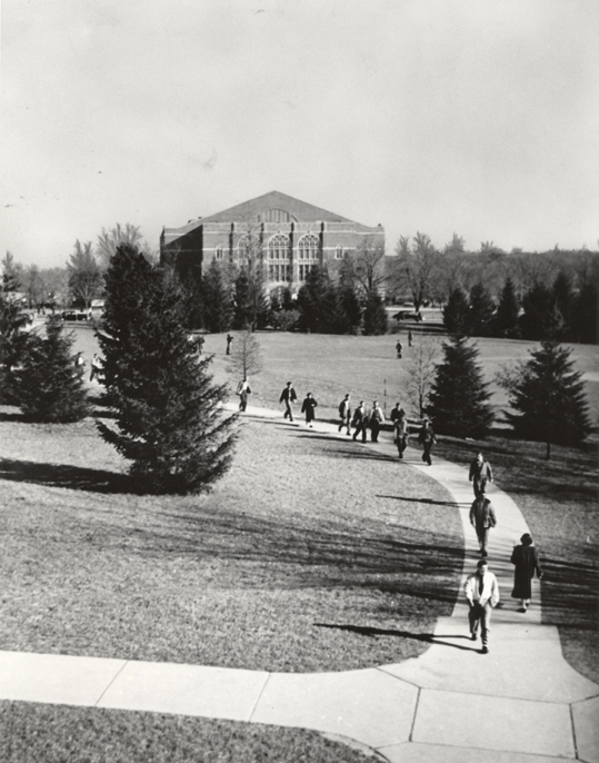 Students following a path near the Auditorium, ca. 1950