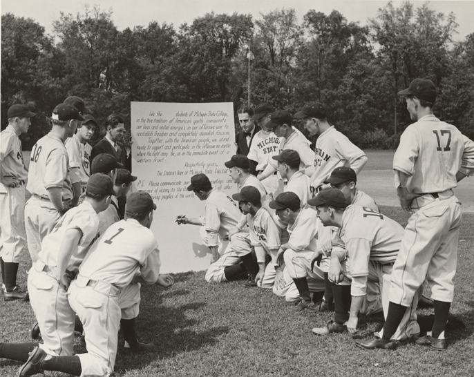 The baseball team signs a pledge, ca. 1940