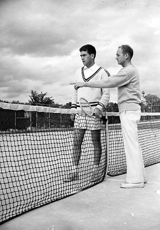 A tennis player and coach discuss tactics, 1950