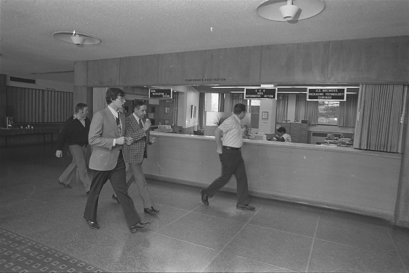 Conference registration desk at the Kellogg Center, 1978