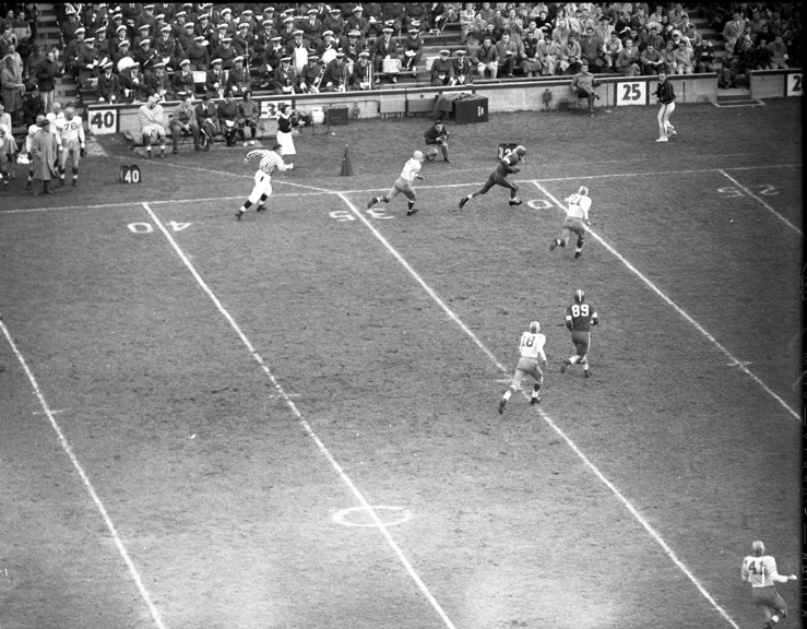 Michigan State vs. Marquette football action shot, 1954