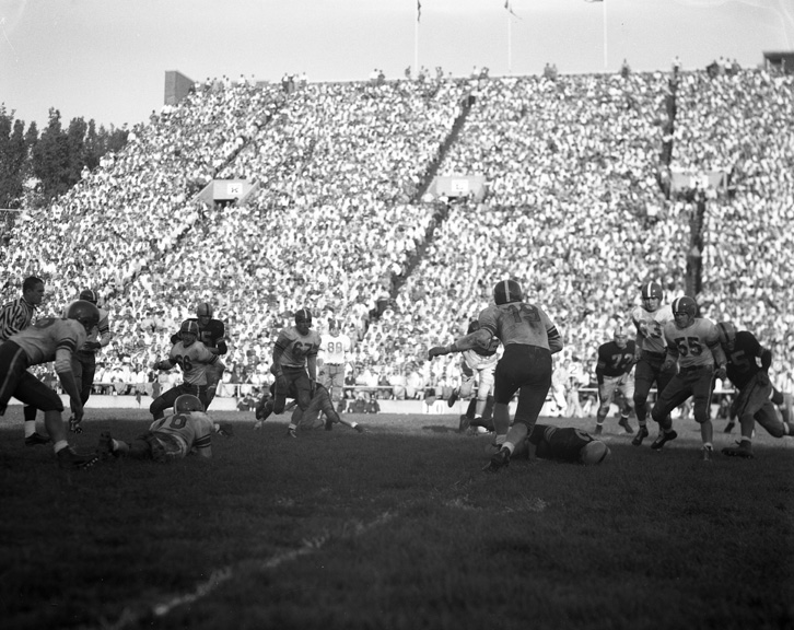 Michigan State vs. Iowa football action shot, 1954