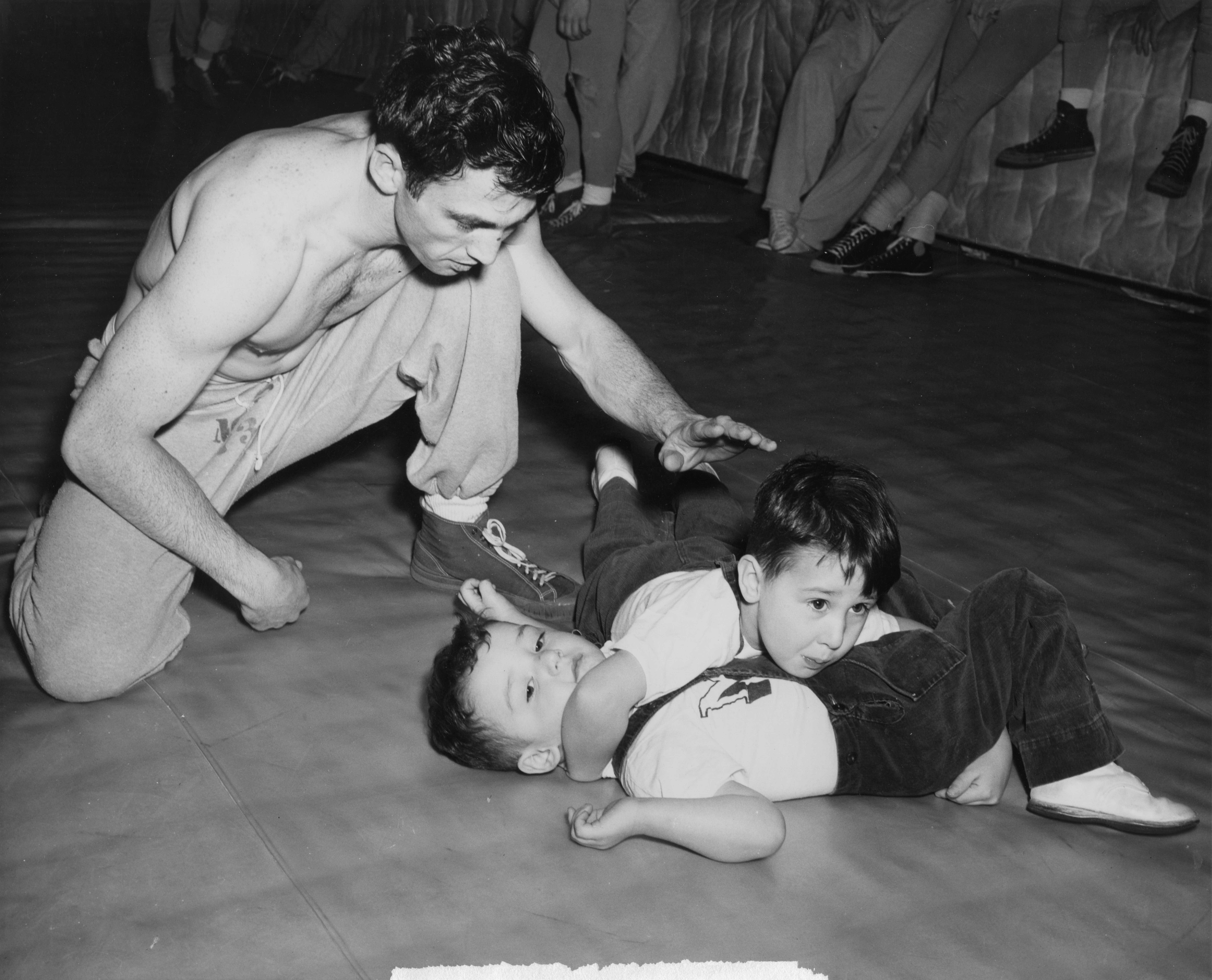 Spartan Varsity Wrestler and his sons, 1949