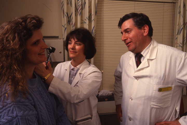 Dr. Howard Brody, CHM student Kathy Fenske and patient