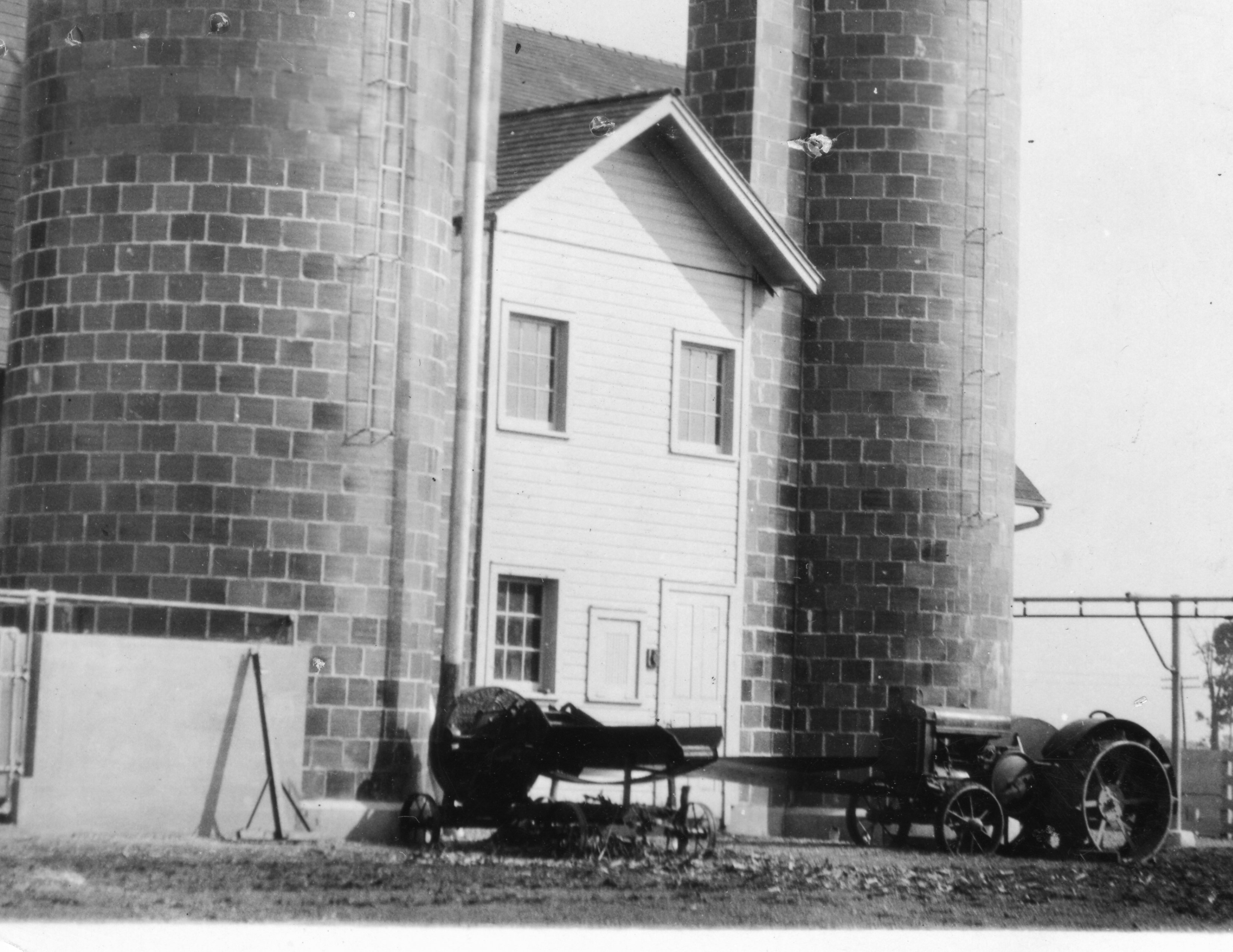 Photograph of dairy barn silos