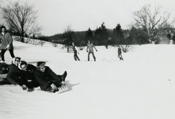 People play in snow at Hidden Lake Gardens, 1960