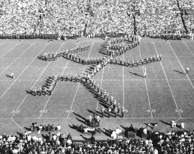 The marching band on the football field, 1955