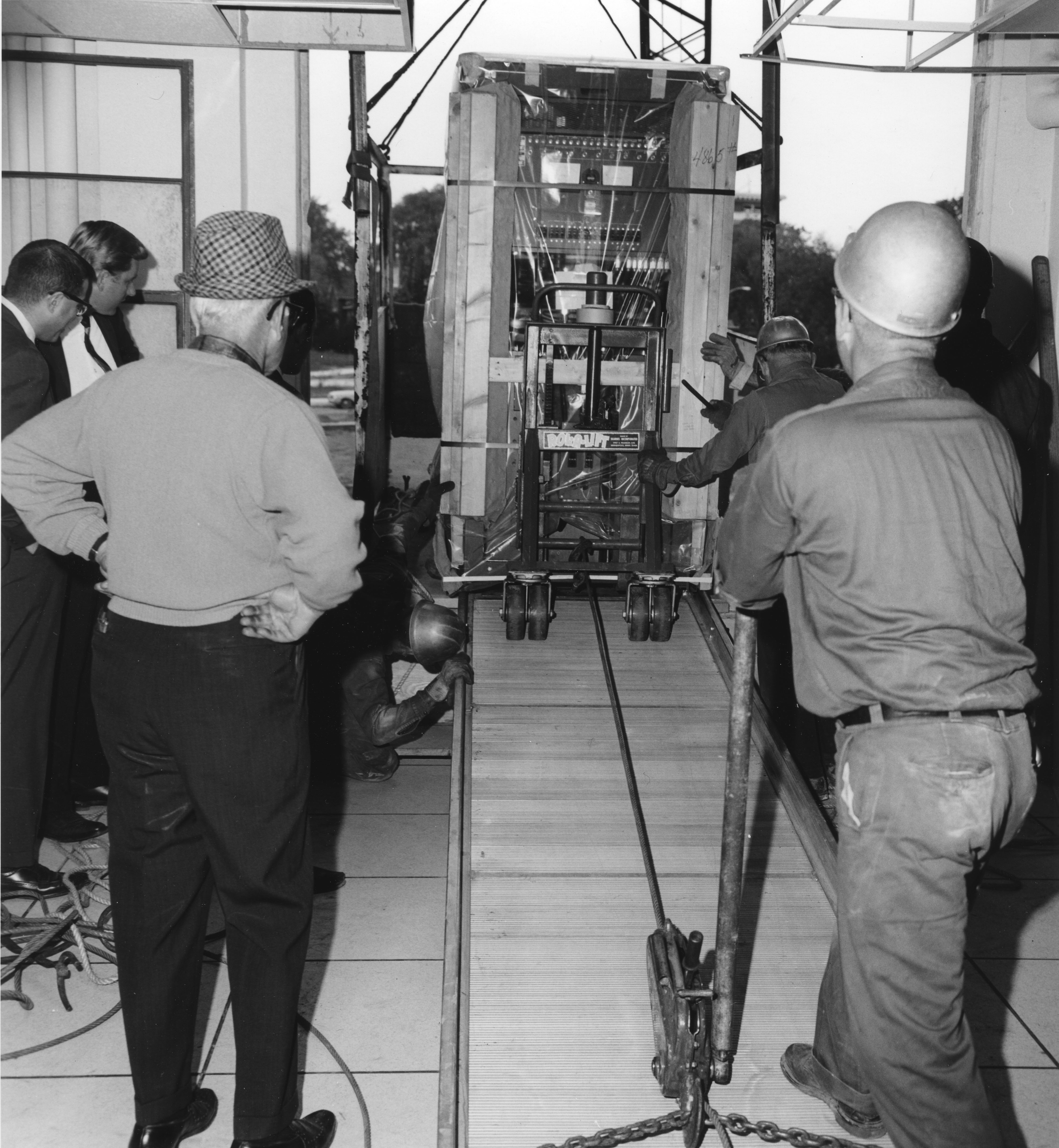 Men moving computer lab equipment into Computer Center, date unknown