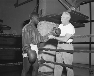 Boxing Coach John Brotzmann and Boxer John Butler, 1956