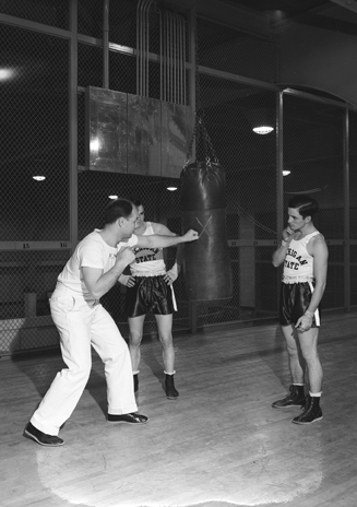 Boxing coach Al Kawal teaching students, 1942