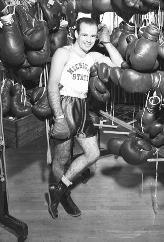 Boxer Ernie Charboneau with Boxing Gloves, 1947