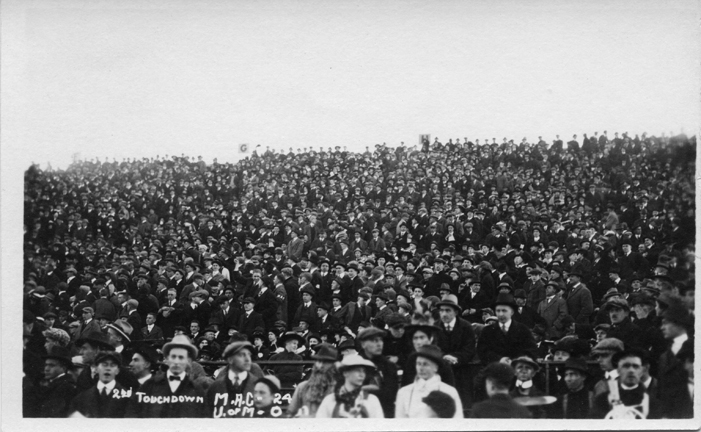 Fans at a M.A.C. vs. University of Michigan football game