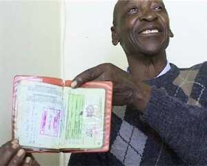 Isaac Malome Masike, a semi-retired small business man from Rammolutsi, shows his old pass book during an oral history interview with Dale McKinley and Ahmed Veriava.