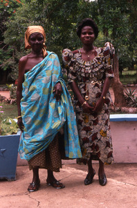 Cloth trader and daughter helper standing dressed up