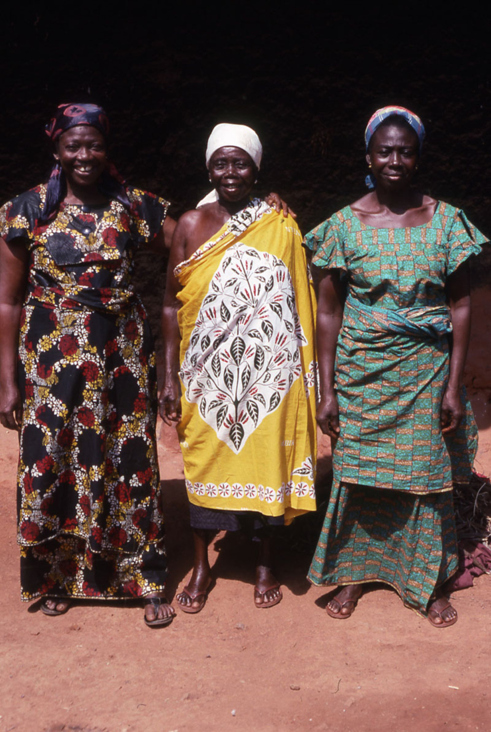 Three standing women in cloth