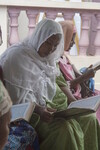 Young Woman Reads Koran