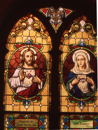 Jesus with Sacred Heart (left) and Mary with Immaculate Heart (right)