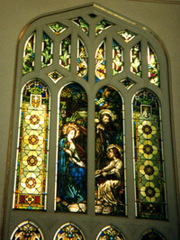 Mary and Joseph teaching boy Jesus