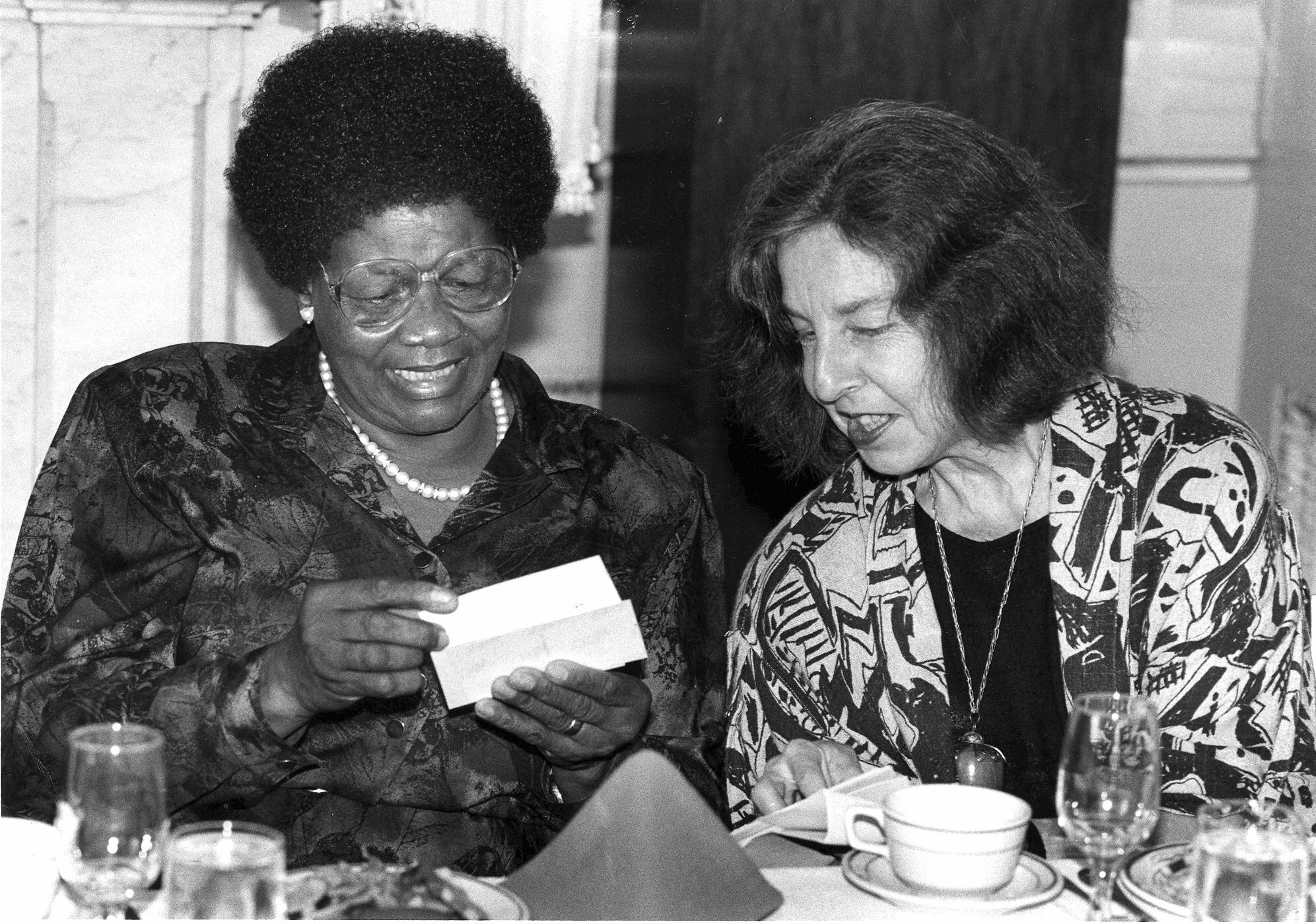 Albertina Sisulu and Jennifer Davis, Executive Director of The Africa Fund. At this time, Albertina Sisulu was a member of the Executive Committee of the African National Congress (ANC) and was active in the ANC Women&#39;s League. Albertina and Walter Sisulu, a leading member of the ANC, were brought to the United States by The Africa Fund to participate in a celebration of the Fund&#39;s 25th anniversary in New York City. The following day, Albertina Sisulu and Davis went to Washington, D.C., where this photo was taken.