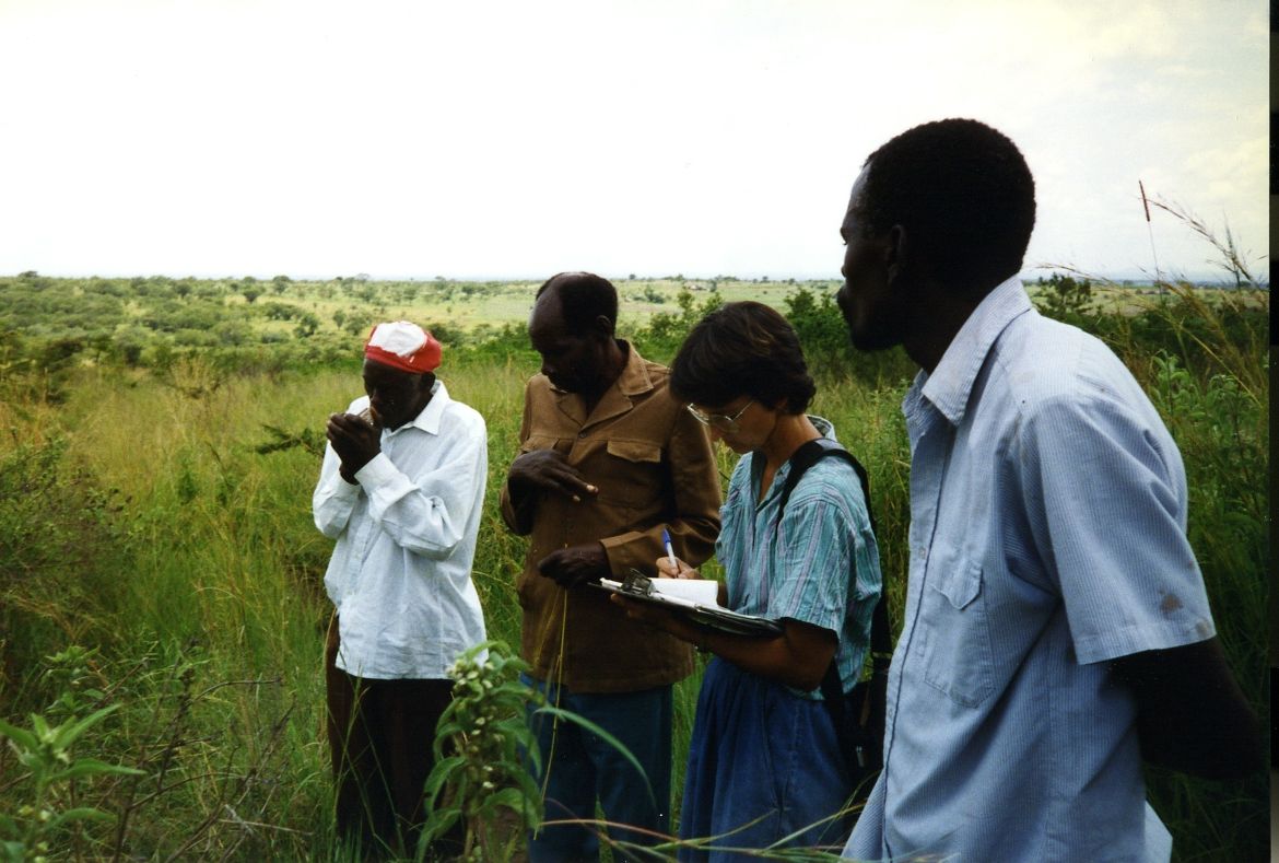 Photograph of Mossi Chagana (left), Joseph Mashohi, Jan Bender Shetler, and Nyawagamba Magotto (right)